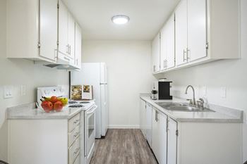 an apartment kitchen at kirkwood meadows with top and bottom cabinets.at Kirkwood Meadows, Pocatello, ID.